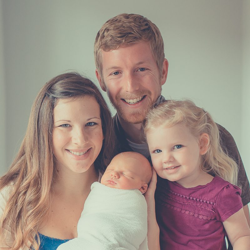 Adrian with his wife, daughter & newborn son.